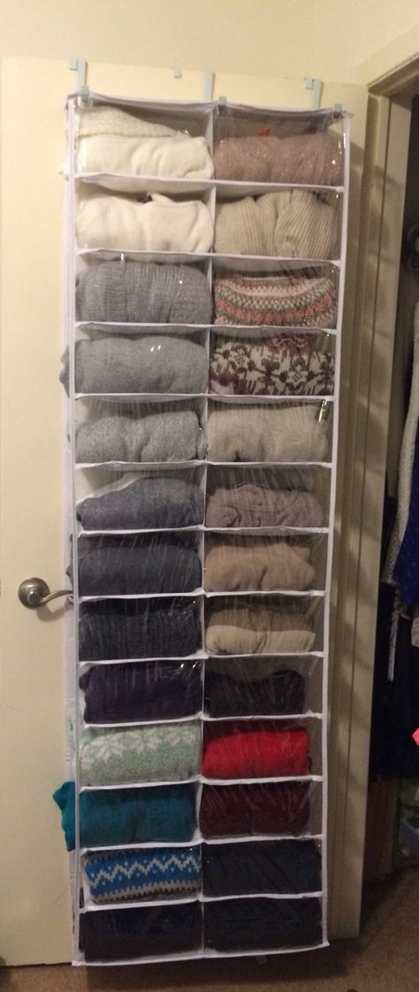 Shoe organizer hack!!! Short on closet space? Take an over the door shoe organizer, and roll all of your knit sweaters. Save's a bunch of room and knits won't wrinkle. Plus you have a full visual of all your sweaters. I'd like to think I'm pretty smart! Though I'm sure someone else has thought of this. Try it out! I love it! Bedroom Closet Door Organizer, Knit Sweater Organization, Over The Door Shoe Organizer Ideas, Sweater Storage Ideas Tiny Closet, Sweater Storage Ideas, Sweatshirt Storage, Sweater Organizer, Sweater Hangers, Single Dorm Room