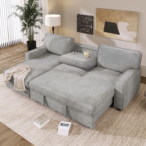 Description: Upgrade your living room with our luxurious and functional L-Shaped Sofa Bed. The pull-out bed, storage chaise, and built-in cup holders offer convenience and versatility, making it perfect for both entertaining and lounging. Pull Out Loveseat Sleeper Sofas, Small Space Sitting Area, Sofa Bed Guest Room, L Shaped Sofa Bed, Bed Mechanism, Pull Out Sleeper Sofa, Upholstered Sofa Bed, Sectional Sofa With Storage, Sleeper Sectional Sofa