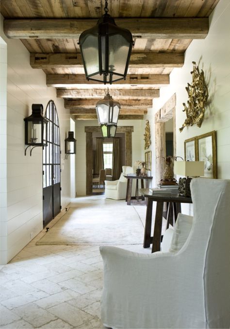 From the same house as seen in the photo above this one, this pass through shows that no space should be overlooked. Photography by Erica George Dines, courtesy of Suzanne Kasler: Timeless Style, Rizzoli 2013. German Farmhouse, Rustic Floors, Case Opening, Rustic Entry, Mediterranean Home Interior, Rustic Hallway, Modern Mediterranean Homes, Foyer Ideas, Floor Door