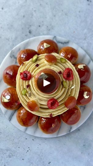 21K views · 2K reactions | (Recipe) Tourbillon Raspberry Pistachio St. Honoré 🌀 - Beware, this is gourmand and addicting! My two favorite flavors in multiple textures combined in an indulgent dessert with all of the praliné. 
Applying the 🌀 technique by @yannbrys here was fun. 

Composition:
- Choux with craquelin, recipe in my blog
- Pâte sucrée base
- Raspberry cremeux, recipe in previous post
- Pistachio whipped ganache
- Pistachio praliné 
- Raspberry confit 
- 
PISTACHIO PRALINÉ 
150g roasted pistachios, unsalted
125g granulated sugar
25g glucose syrup (or light corn syrup)
40g water
QS grape seed oil (or vegetable oil)

PISTACHIO WHIPPED GANACHE 
125g heavy cream (1) 
30g invert sugar (e.g., light corn syrup) 
75g white chocolate, high quality 
50g pistachio praliné
25g pistachio p Cremeux Recipe, Raspberry Confit, Craquelin Recipe, Raspberry Pistachio, Roasted Pistachios, Whipped Ganache, Indulgent Desserts, Grapeseed Oil, Corn Syrup