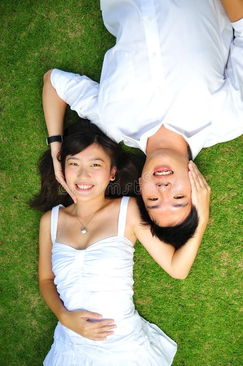 Couple In Love Lying On The Grass. Asian Couple In Love Spending Time In The Par #Sponsored , #sponsored, #SPONSORED, #Love, #Grass, #Time, #Lying Grass Drawing, Lovers Images, Asian Couple, People Lie, Image Couple, Couple In Love, Body Reference Poses, Couples Images, People Sitting