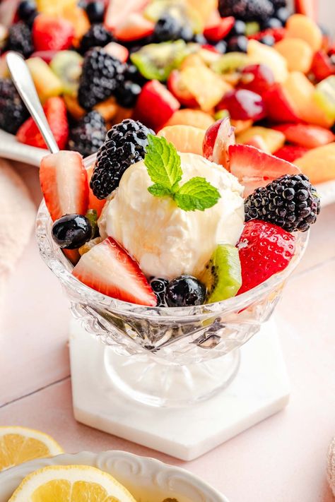 This homemade fruit salad with ice cream is a beloved family recipe. With a secret ingredient that makes it unlike any other, this recipe is a must-have summer treat! Fruit Salad Ice Cream, Fruit Salad With Ice Cream, Ice Cream With Fruit, Homemade Fruit Salad, Froyo Recipe, Fruit Ice Cream, Types Of Desserts, Fruit Toppings, Frozen Custard