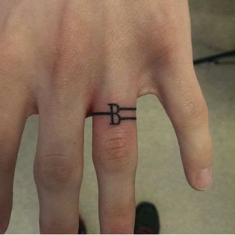 Cute wedding ring tattoo. Letter. Tattooed Rings, Wedding Rings Tattoo, Tattoo Side, Ring Tattoo Designs, Wedding Band Tattoo, Rings Tattoo, Tattoo Band, Ring Tattoo, Wedding Ring Tattoo