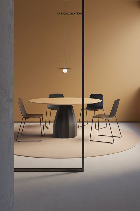 Designed by Patricia Urquiola, Burin table’s silhouette plays tribute to the traditional wood carving tools. With Burin table you can combine different finishes, heights and dimensions for the base and tabletop, adapting to the aesthetic requirements of each space. Black Round Dining Table, Patricia Urquiola, Meeting Table, Bureau Design, Workplace Design, Elegant Furniture, Office Decoration, Office Interior Design, Commercial Design