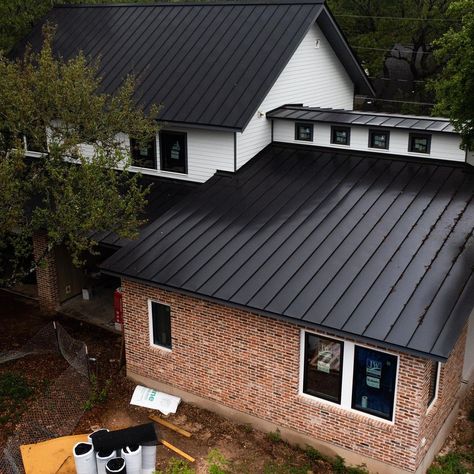 Tin Roof On Brick House, Black Metal Roof Brick House, Black Standing Seam Metal Roof, Metal Roof Brick House, Black Tin Roof, Black Steel Roof, Painting Siding, Metal Shed Roof, Laundry Reno