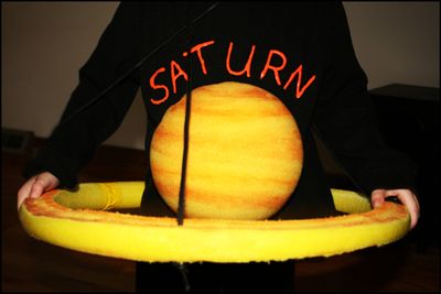 Saturn - Best Halloween Costumes For Pregnant Bellies | The Baby Post Saturn Costume, Halloween Costumes For Pregnant, Maternity Costumes, Pregnant Bellies, Pregnancy Costumes, Pregnancy Ideas, Pregnant Halloween Costumes, Holloween Costume, Best Halloween Costumes