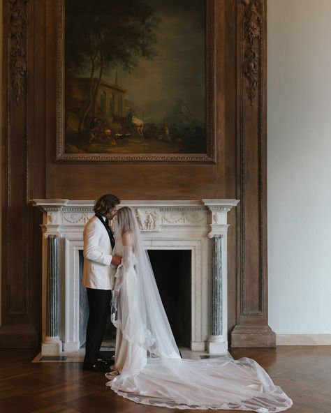 Intimate wedding moment by the fireplace, romantic wedding photography, Beverly Hills luxury wedding, bride in veil with groom in tuxedo, fine art wedding photographer, elegant wedding design, classic black-and-white wedding decor, Somni Events wedding planning, timeless wedding inspiration, wedding ceremony in Beverly Hills mansion 🖤💍🎩✨ Bride In Veil, Groom In Tuxedo, Fireplace Romantic, Day Planning, Beverly Hills Mansion, Reflection Photos, Romantic Couple Poses, Golden Hour Photos, Romantic Wedding Photography