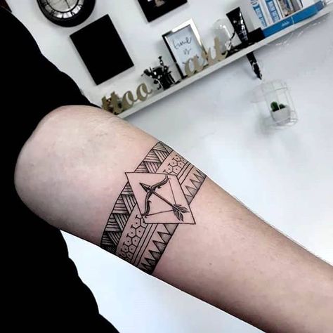 A bow and arrow tribal tattoo for men by @vilko_ink- Creative Sagittarius zodiac tattoo ideas Archery Tattoo, Sagittarius Tattoos, Mens Arrow Tattoo, Arrow Forearm Tattoo, Couple Wrist Tattoos, Sagittarius Tattoo Designs, Bow Tattoo Designs, Puzzle Tattoos, Sagittarius Tattoo