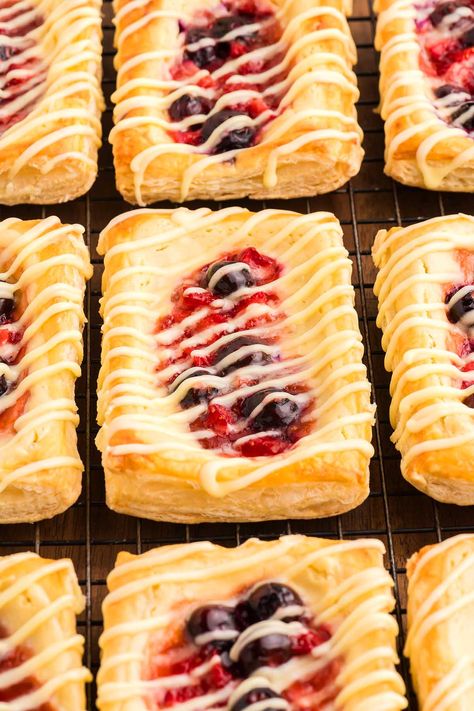 If you like to start the day with something delicious, stop scrolling, bookmark this recipe and whip up a batch of flavorful Danishes. They're soft, sticky and just bursting with incredible creamy, fruity flavors in every bite. You can use whichever fresh berries happen to be your favorite to customize them. These tasty little bites, served fresh from the oven, are sure to impress everyone at the breakfast table. Or you could serve them as sweet treats with a coffee or even have them for ... Berry Danish, Cream Cheese Danish Recipe, Cheese Danish Recipe, Danish Recipe, Cream Cheese Danish, Puff Pastry Dough, Stop Scrolling, Danish Food, Delicious Cream