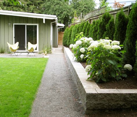 Third Nature Studio | Hydrangeas in raised bed, Midcentury Ranch Stone Raised Beds, Midcentury Ranch, Landscape Ideas Front Yard Curb Appeal, Landscaping Along Fence, Garden Retaining Wall, Raised Flower Beds, Mid Century Ranch, Patio Garden Design, Backyard Inspiration