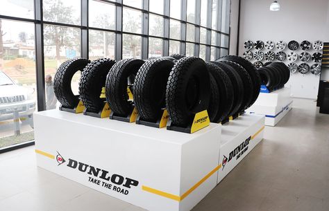 Tire Display Ideas, Tire Shop Decor Ideas, Branding Signage, Shop Shelving, Minimal Bathroom, Tire Shop, Automotive Shops, Car Workshop, Showroom Interior Design