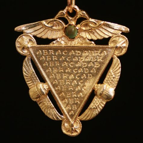 Victorian era amulet with Egyptian symbols and turquoise. Abracadabra: this word is of ancient origins. In a poem on occult medicine written by a pagan doctor in ancient Rome about 250 AD, to ward off fevers and sickness, the physician recommended the word abracadabra be written down in an inverted triangle. The word abracadabra comes from worship of the gnostic God, Abraxas. It literally means: The dead body, or corpse, of Abraxas. Arte Judaica, Ancient Egyptian Symbols, Victorian Pendants, Egyptian Symbols, Magic Words, Victorian Jewelry, Ancient Egyptian, Estate Jewelry, Jewelry Inspiration