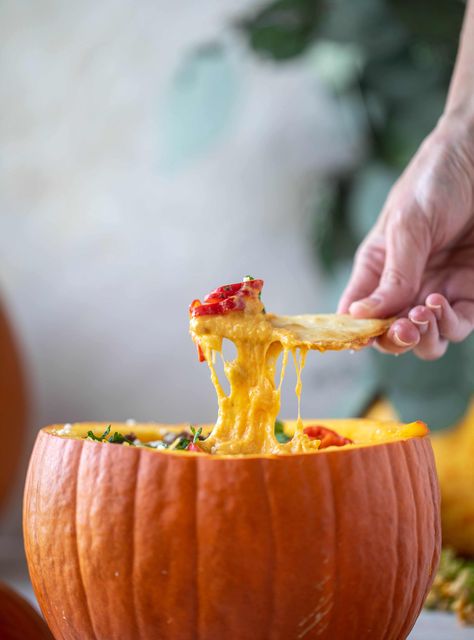 This pumpkin queso fundido is the perfect indulgence for fall. Warm pumpkin queso topped with chroizo, pepitas and jalapeños. It's delish! Pumpkin Queso Dip, Savory Pumpkin Dip Recipes, Pumpkin Queso Fundido, Roasted Pumpkin Cheese Fondue, Pumpkin Queso, Halloween Pumpkin Guacamole Dip, Queso Fundido With Chorizo, Queso Fundido Recipe, Fundido Recipe