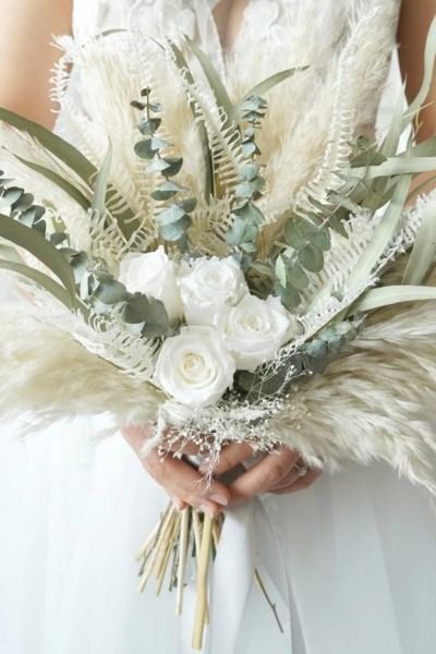 Discover the enchanting beauty of dried flower bouquets for your wedding day! 🌼💍 Explore our curated collection from Etsy that promises unique and everlasting floral arrangements. Embrace the rustic charm and lasting elegance of dried blooms to add a touch of nature to your special celebration. 🌿✨ #DriedFlowerBouquet #EtsyFinds #WeddingFlorals #EverlastingLove #RusticWedding #NaturalElegance #weddinginspiration Dry Wild Flowers, Greenery And Dried Flowers Bouquet, Dried White Flowers Wedding Bouquets, Green And White Bridal Bouquet Dried Flowers, Dried Flower Bouquet Green, Rustic Bridal Bouquet Dried Flowers, Dried Flower Bouquet Wedding, Dried Flower Bouquets, Diy Bridal Bouquet