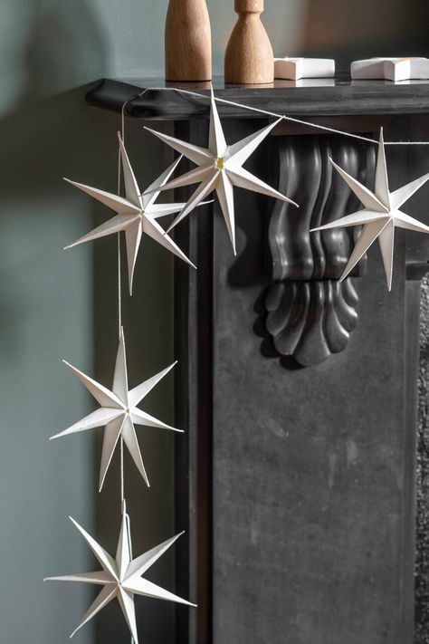 Go plastic free this year with Maddox Star Garland, a Christmas decoration crafted in recycled pre-consumer cotton paper in our stylish Warm White and Ink colourways. They arrive fully assembled and ready to adorn your stairway or mantelpiece, with 8 stars that are linked by string that is dyed to match. With no plastic used for the packaging, this garland is an eco-conscious choice for decorating during the festive period. Holiday Hanging Decor, Winter Forest Decor, Paper Star Christmas Decorations, D.i.y Christmas Decorations, Paper Mache Christmas Decorations, Paper Stars Christmas, Christmas Paper Stars, Christmas Paper Garland, Hygge Christmas Decor