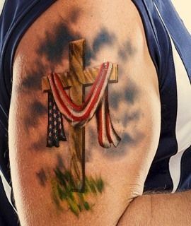 American Flag on a Christian Cross God And Country Tattoo, American Flag Memorial Tattoo, Feminine Patriotic Tattoos, Cross American Flag Tattoo, Cross With American Flag Tattoo, Cross With Flag Tattoo, Faded American Flag Tattoo, American Flag Bicep Tattoo, Police Tattoo