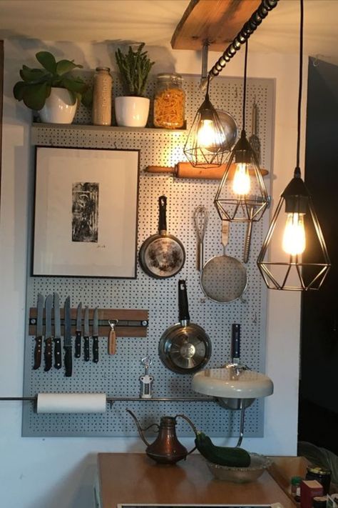 Tired of cluttered countertops? This clever vertical storage solution will transform your small kitchen and home! Check out our blog for more genius vertical storage ideas. Small Kitchen Vertical Storage, Pan Holder Hanging Wall, Peg Board Kitchen, Kitchen Pegboard Ideas, Vertical Storage Ideas, Kitchen Pegboard, Storage Solutions For Small Spaces, Hanging Kitchen Utensils, Pegboard Kitchen