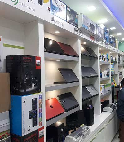 Laptop Store Interior Design, Electronic Shop Interior Design, Small Shop Interior Design, Small Shop Interior, Electronics Store Design, Mobile Shop Design, Diy Bookshelf, Computer Shop, Anamika Khanna