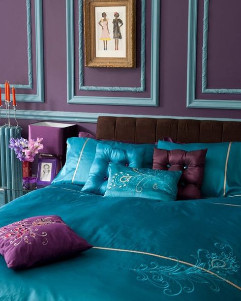 This may be one of my favorite designs on the list. The bed is covered with a gorgeous silk comforter with embroidered flower designs on it. The teal and purple pillows also have some stitch work done and some crystal accents sewn onto them. Behind the bed is a beautiful purple wall with teal trim work all around it. This is definitely something that can be easily recreated for a stunning new look in your home. Peacock Bedroom, Blank Frames, Peacock Room, Teal Curtains, Moroccan Colors, Teal Trim, Turquoise Room, Bedroom Turquoise, Teal Bedroom