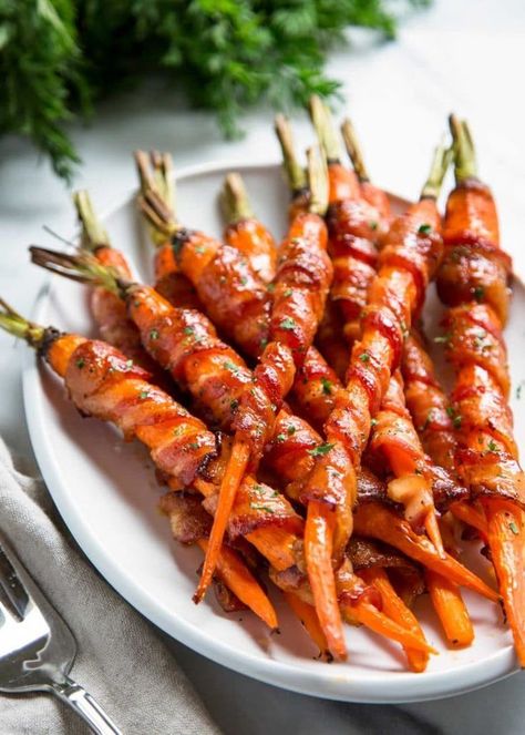 Looking for an appetizer that will really wow? Try these marinated bacon-wrapped carrots —the maple and sriracha glaze will blow your socks off! They also make a decadent side dish for the holidays. | Recipe by Kevin is Cooking #holidaydishes #warppedcarrots Bacon Wrapped Carrots, Maple Carrots, Sides Veggies, Maple Sriracha, Maple Glazed Carrots, Bacon Crisps, Best Thanksgiving Side Dishes, Carrots Recipe, Delicious Thanksgiving