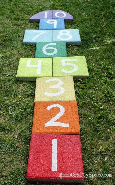 I posted a quick peek at the boys’ latest garden project on Instagram a couple of weeks ago, and it seems that we’re not the only ones who think it’s super cool! Someone asked me how we made our fun colorful hopscotch, so I thought I’d share a few pics…since I take pictures of everything... Painting Pavers, Daycare Playroom, Landscape Makeover, Cement Pavers, Kid Friendly Backyard, Diy Kids Playground, Kids Yard, Large Backyard Landscaping, Painted Concrete