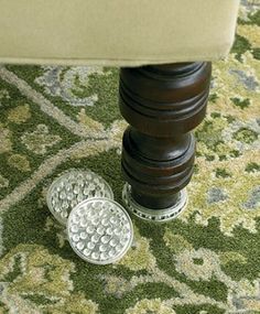 To protect carpet from dents, support heavy furniture on plastic or rubber floor protectors that are at least an inch in diameter. The heavier the piece of furniture, the larger the floor protector should be. Diy Handyman, Cleaning Day, Floor Protectors, Rubber Flooring, Furniture Protectors, House Flooring, Cleaning Organizing, Home Maintenance, Organizing Your Home