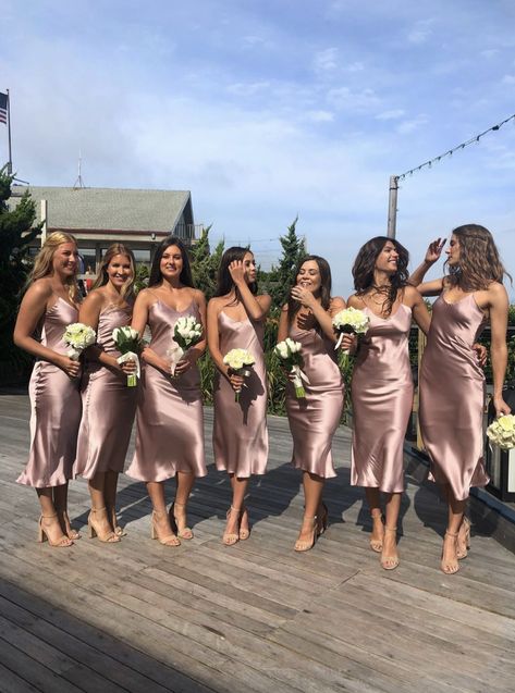 7 Bridesmaids wearing silk mid length dresses. All holding white bouquet of flowers outside. Hair is styled with loose waves. Simple Short Bridesmaid Dresses, Slip Bridesmaids Dresses, Simple Party Dress, Rose Gold Bridesmaid Dress, Silk Bridesmaid Dresses, Spaghetti Strap Bridesmaids Dresses, Tea Length Bridesmaid Dresses, Rose Gold Bridesmaid, Champagne Bridesmaid Dresses