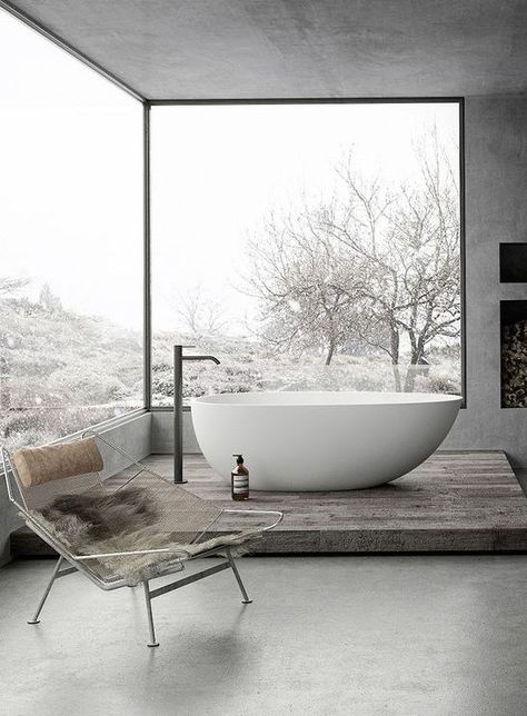 a gorgeous grey bathroom done with concrete, with glazed walls, a fireplace and a tub on a platform Taupe Bathroom, Grey Bathrooms Designs, Tub Remodel, Bedroom With Bath, Concrete Bathroom, Glazed Walls, Casa Country, Grey Bathroom, Bad Inspiration