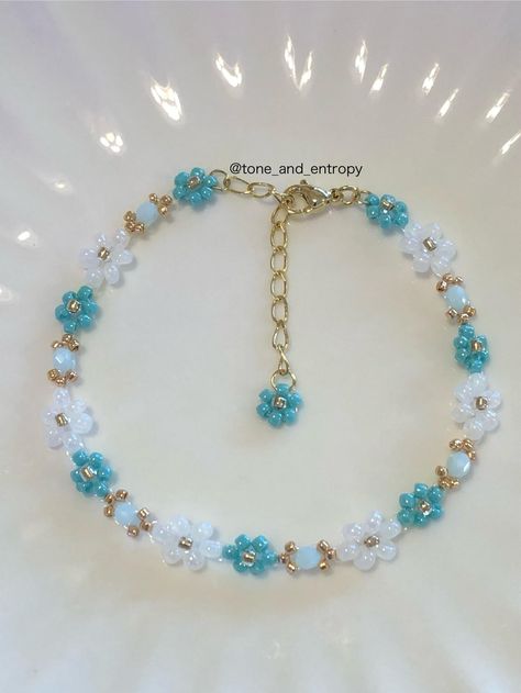 Beautiful bijou with beaded flowers. This design has another color. (Picture 2) -Materials 8/0, 11/0, 15/0 Glass beads (Made in Japan) Glass cut beads Adjuster chain -Length About 19cm=7.4Inch (Include 4cm=1.5Inch Adjuster Chain) -And More If you need to change bracelet length shorter or longer, then please contact me. I can change adjuster chain's length. Or if you need to change color, then contact to me. -Note Please avoid from water, then jewelry keep shining. Beaded jewelry is delicate, so please handle it gently. -Shipping Normal shipping ---> international air mail with no tracking. Upgrade shipping ---> express air mail with tracking. If you'd like to track your order, please select the tracking service at the time of payment. -About my jewelry I mainly use beautiful and high quali Bracelet Making Tutorial, Beaded Flower Bracelet, Beads Keychain, Diy Friendship Bracelets Tutorial, Keep Shining, Friendship Bracelets Tutorial, Friendship Bracelets Diy, Bead Work Jewelry, Work Jewelry