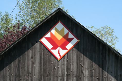 “Maple Leaf” quilt pattern on a barn in Door County Wisconsin Maple Leaf Barn Quilt, Maple Leaf Quilt Pattern, Leaf Quilt Pattern, Maple Leaf Quilt, Leaf Quilt, Painted Barn Quilts, Door County Wisconsin, Barn Quilt Designs, Barn Quilt Patterns