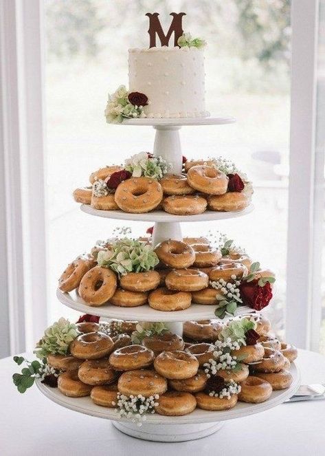 20 Adorable Wedding Donut Bar Ideas 2024 Donuts Instead Of Wedding Cake, Donut Bar At Wedding, Wedding Cake And Donuts Display, Wedding Cake With Donuts Around, Wedding Donut Display Dessert Tables, Wedding Lolly Bar, Brunch Wedding Shower Ideas Food Bars, Wedding Donuts Display, Donuts Wedding Display