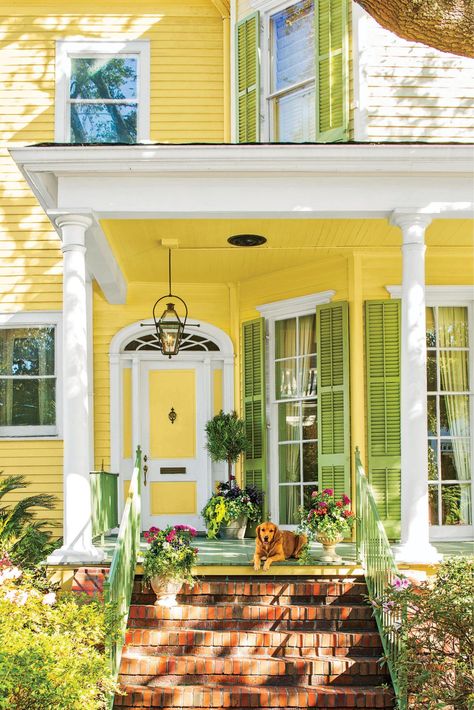 As long as you are painting the door, why not pain the whole house? Yellow and green is just about as springtime as it gets. #springcurbappeal #frontdoorideas #frontdoorpaintcolors #southernliving Yellow House Exterior, Green Shutters, Yellow Cottage, Yellow Door, Yellow Doors, Yellow House, Painted Front Doors, Yellow Decor, Yellow Houses