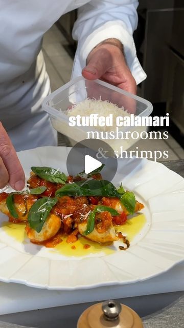 Joseph Hadad on Instagram: "WOW 🤯 you need to try this… Shrimps and Mushrooms Stuffed Calamari 🦑 

Filling:
- 7-8 medium calamari
- 4 large mushrooms
- 7 shrimp
- 1 tablespoon chopped parsley
- 1 white onion
- 4 tablespoons of olive oil
- 2 sprigs green thyme (leaves hurt)
- Salt and pepper to taste

Sauce:
- 7-8 tomatoes (medium to large, grated)
- 1 white onion
- 2 cloves of garlic
- 6-7 basil leaves
- 4 tablespoons white wine
- 1/2 hot pepper (or more if you want it more spicy)
- 4 tablespoons of olive oil
- 2 sprigs of green thyme
- Salt and pepper to taste
- a few pitted olives
+Basil and Parmesan for decoration

Process:
1. Filling: Saute the chopped onion in the hot oil until it is translucent. Add the finely chopped mushrooms, salt, pepper, thyme leaves and cook for 5 minutes. Ad Stuffed Calamari Tubes Recipe, Stuffed Calamari, Mushrooms Stuffed, Thyme Salt, Large Mushroom, Hot Pepper, Basil Leaves, White Onion, Hot Oil