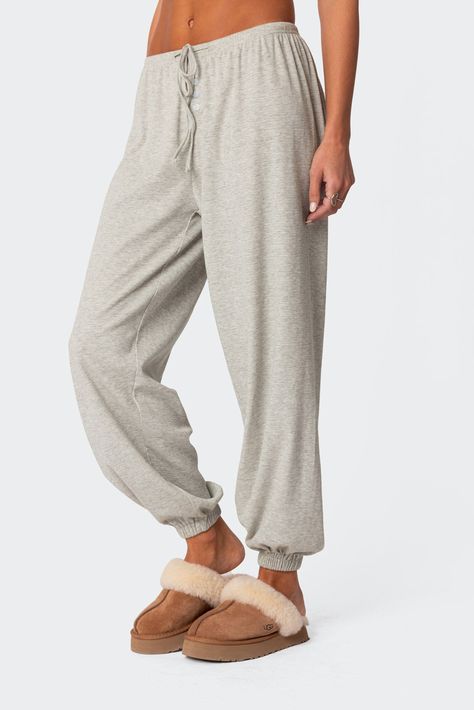 Loungewear pajama sweatpants Loose fit Button front detail Adjustable tie waist Elastic ankles Waffle fabric Cotton, Spandex Model wears size S Model height is 5'9 Item care: Wash with similar color Waffle Fabric, Swimwear Dress, Womens Pyjama Sets, Womens Loungewear, Pajamas Women, Pacsun, Bottoms Pants, Model Height, S Models