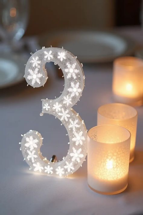 Planning a winter wedding? Explore these 18 unique centerpieces that will add a magical touch to your celebration! From intriguing snowflake-themed table numbers and beautiful votives to cozy candle arrangements, these winter wedding centerpieces are designed to make your special day unforgettable. Share the romance of the season with guests and make memories both beautiful and bright. Transform your tablescape into a winter wonderland that'll charm everyone. Perfect for winter enchantment, find centerpieces that oh-so-finish your wedding vibe! Wedding Centerpieces Ideas, Cozy Candle, Winter Wedding Centerpieces, Snowflake Wedding, Candle Arrangements, Small Wedding Cakes, Centerpieces Ideas, Cozy Candles, Unique Centerpieces