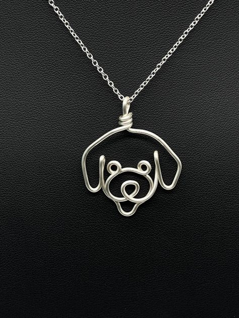 Miniature Poodle Necklace, perfect for dog moms. Pendant is handmade from a single piece of 1.3 mm tarnish free silver plated copper wire.  Chain thickness is 1.2 mm, 18 inch silver plated chain with lobster clasp.   Approximate pendant size: Width: 35 mm  Height: 40 mm  FAQs: - Minor dents may be present from the wire bending process.  Coat pliers are used to minimize dents.   - The ends of the wire pendant may appear yellow as it is silver plated copper wire.  Care instructions: To prolong the Wire Charms, Copper Wire Crafts, Wire Dog, Wire Bending, Wire Jewelry Patterns, Wire Wrap Jewelry Designs, Wire Wrapped Jewelry Diy, Bijoux Fil Aluminium, Face Pendant