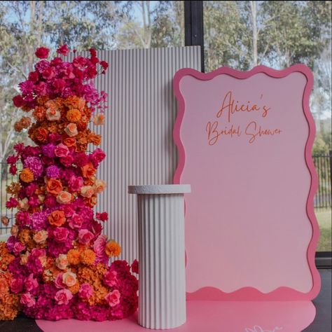 Hot Pink And Orange Backdrop, Pink Orange Backdrop, Pink And Red Backdrop, Pink Orange Bridal Shower Theme, Spring Soiree Party, Hot Pink And Orange Bridal Shower Ideas, Red And Pink Backdrop, Orange And Pink Bridal Shower Ideas, Pink And Orange Bridal Shower Decor