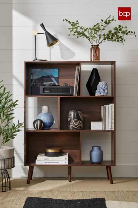 This bookcase's modern appeal fits throughout your home as the perfect display space in your living room, office, or nursery Mid Century Modern Bookshelf, Mid Century Modern Bookcase, Geometric Bookcase, Mid Century Aesthetic, Modern Bookshelf, Modern Bookcase, Cube Organizer, Nursery Organization, Wooden Bookcase