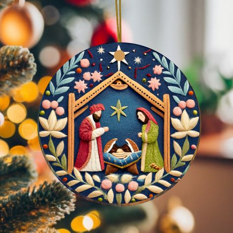 Introducing our captivating 2.75 inch Nativity Painting Christmas Ornament, not real embroidery, but meticulously printed on durable ceramic! This ornament showcases a beautiful manger scene that will infuse your holiday decor with warmth and wonder. 🌟 **Celebrate the Nativity Immerse yourself in the timeless Nativity story with this masterfully painted ornament. Every brushstroke, from Mary, Joseph, and Baby Jesus to the humble animals, is a work of art that brings this cherished tale to life. 🖼️ **High-Quality Ceramic Print This isn't your average ornament; it's a high-quality ceramic print that captures the essence of the Nativity scene with vivid colors and intricate details. The charm of the painting radiates brilliantly. 🎄 **Effortless Holiday Decor Hanging this ornament is a bree Nativity Painting, Christian Ornaments, The Nativity Story, Unique Christmas Decorations, Nativity Ornaments, Painted Christmas Ornaments, True Meaning Of Christmas, Meaning Of Christmas, Christmas Room Decor