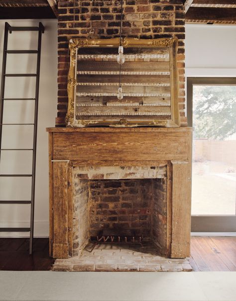 One of six fireplaces in the Rice and Nissenboim residence. Primitive Fireplace, Exposed Brick Fireplaces, Antique Mantel, Roof Beam, Amazing Homes, Fire Places, Old Fireplace, Farmhouse Fireplace, Rustic Fireplaces