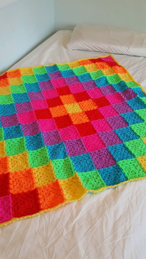 Adalena's Neon Rainbow. Made in Stylecraft Special DK using the join as you go method. Colorway inspired by darkrose's mini square blanket. Neon Crochet Projects, Color Changing Yarn Crochet Blanket, Bright Crochet Blanket, Vibrant Crochet Blanket, Bright Granny Square Blanket, Neon Granny Square Blanket, Primary Color Crochet Blanket, Crochet Throw Pattern, Crochet Cow