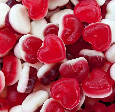 Strawberry flavoured jelly sweets with a soft foam bottom. Ingredients For allergens please see ingredients listed in CAPITALS Glucose Syrup, Sugar, Water, Beef Gelatine, Acid (Citric Acid), Apple Juice Concentrate, Vegetable Concentrates (Carrot, Sweet Potato, Radish), Flavourings, Vegetable Oil (Palm), Glazing Agents (Carnauba Wax, Beeswax). May contain traces of NUTS, PEANUTS, CEREALS CONTAINING GLUTEN, MILK, EGGS. Please Note: All products may contain traces of NUTS, GLUTEN & DAIRY due to being prepared in the same environment as other products. *Whilst every effort has been taken to ensure the accuracy of the product information provided, products and their ingredients may change. You are advised to always read the product label on arrival for ingredients, nutrition, dietary claims an Haribo Hearts, Gummy Hearts, Jelly Hearts, Jelly Sweets, Valentines Candy, Heart Shaped Candy, Strawberry Candy, Juice Concentrate, Valentine Candy