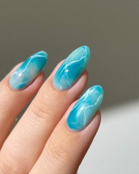 Aistė ❣︎ on Instagram: "🐬🫧 obsessing over marble nails lately :) and I love how bold and vibrant this teal color is !!  Using: @gelcare.official Coconut Milk | Jelly Teal | French Alps | Blooming Gel || For 15% off use code: AISTE _____ (*aff) #greennails #bluenails #marblenails #tealnails #pastelnails #springnails #nails #nailinspo #nailart  gradient ombre marbles, cute nails , almond nails , nail art tutorial," Water Blue Nails, Blooming Gel Marble Nails, Blue Blooming Gel Nails, Summer Colors For Nails, Teal Marble Nails, Blue Teal Nails, Water Effect Nails, Coconut Nails, Cheap Nail Designs