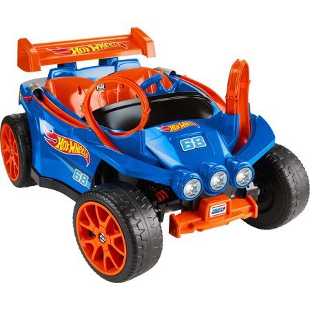 Young racers can live out their ultimate racing dreams with this Power Wheels Hot Wheels Racer ride-on vehicle from Fisher-Price. This epic ride-on combines the driving excellence of a Power Wheels vehicle, including 12-volt battery power, high-speed lock out and Power-Lock brakes, with Hot Wheels styling, graphics, and track play for a super-cool experience. Kids can launch and race their die-cast cars on the vehicles mounted track, then hop in the drivers seat to create their own life-size rac Hot Wheels Birthday, Hot Wheels Party, Hot Wheels Track, Toy Cars For Kids, Riding Toys, Power Wheels, Fisher Price Toys, Hot Wheels Cars, Ride On Toys