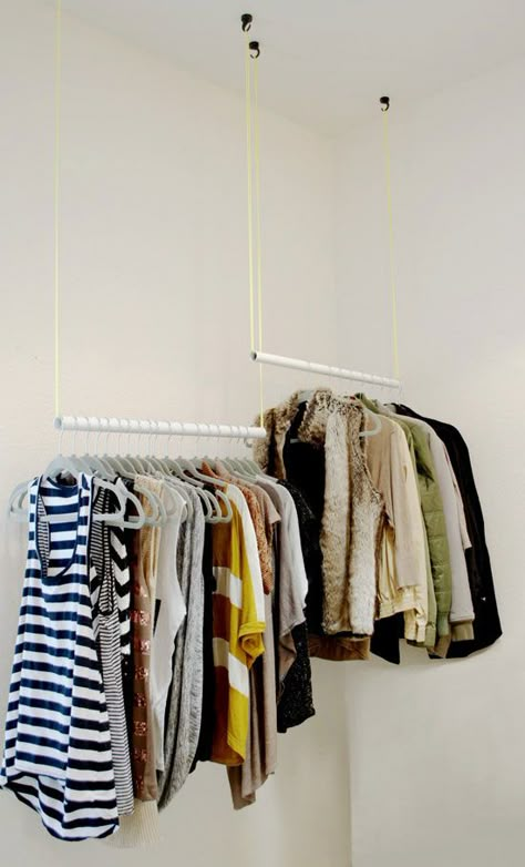 This idea's a little high-concept, but can help fill any closet efficiently. The differing heights separate clothes by type, and ensure longer items won't drag on the floor. Get the tutorial at The Design Confidential »   - HouseBeautiful.com Coat Closet Ideas, Small Coat Closet, Diy Clothes Rack, Closet Hacks Organizing, Closet Rods, Clothes Closet Organization, Clothes Hanging, Open Closet, Small Closets