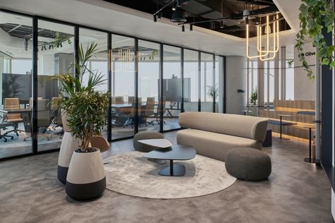 Oliver Wyman Offices - Abu Dhabi | Office Snapshots Office Lounge, Modular Lounges, Exposed Concrete, Open Office, Office Snapshots, Architecture Office, Oak Furniture, Meeting Room, Lounge Areas