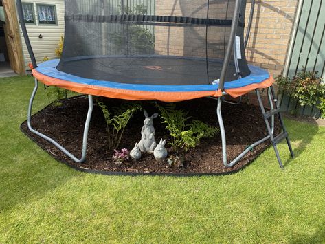 Garden Layout With Trampoline, Trampoline Set Up, Rocks Under Trampoline, Mulch Under Trampoline, Backyard Trampoline Landscape, Trampoline In Garden, Trampoline Landscape Ideas, Trampoline Landscaping, Trampoline Backyard