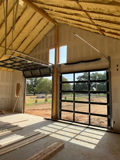 Clear Garage Door Ideas, Venue With Garage Doors, Transparent Garage Door, Modern Black Garage Door, Modern Black Garage, Clear Garage Doors, Rolling Garage Door, Industrial Garage Door, Black Garage Door