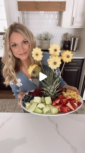 Chelsea Zutavern on Instagram: "Easter Fruit Salad!🌼
This is an easy and fun way to serve fruit for Easter brunch or any gathering this spring/summer!
Just save your pineapple top.🍍I sliced my pineapple and then used a cookie cutter to cut out flowers. I used wooden skewers to place the flowers in the pineapple top and added blueberries 🫐 to the center of the flower with toothpicks. 
Add your favorite fruit and serve!!
🍓🍇🥝🍍🫐 Enjoy!!
.
.
#fruit #fruitbowl #fruitsalad #eastersalad #saladrecipes #springrecipes #easyrecepies #foodreels #funfood #foodforkids #recipeideas #easterfood #easterideas #easterforkids #funwithfruit #healthyfood" Fruit For Easter, Pineapple Fruit Display, Immunity Cubes, Cute Fruit Tray Ideas, Easter Fruit Salad, Easter Salad, Easter Fruit, Wooden Skewers, Summer Food Party