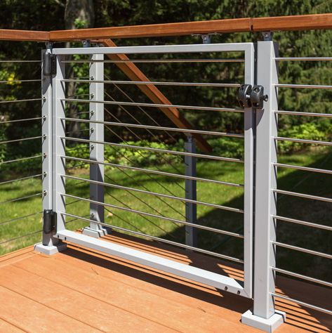 Keep your deck stunning while adding extra security with a cable railing gate kit. Gate kits are available in two styles--universal top and domeless. Mid Century Deck, Cable Fencing, Porch Gate, Deck Gate, Blue Beach House, Cable Railing Deck, Patio Railing, Cable Railing Systems, Gate Kit